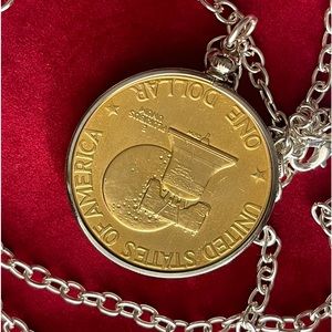 In a class by itself Gold plated 1 dollar coin pendant necklace